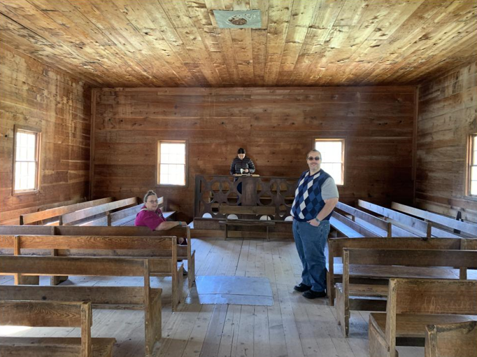 A group of people in a wooden room

Description automatically generated with low confidence