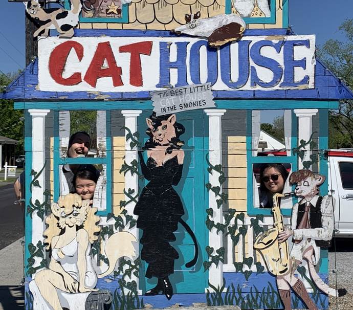 A group of people in a cat house

Description automatically generated with low confidence